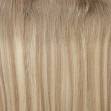 Load image into Gallery viewer, Close-up of blonde hair extensions with a focus on texture and color.