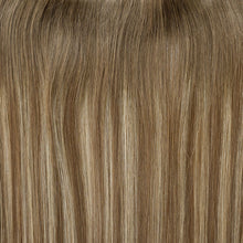 Load image into Gallery viewer, Close-up of brown hair extensions with a focus on texture and color.
